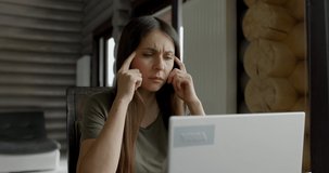 Stressed businesswoman working on computer, feeling tired