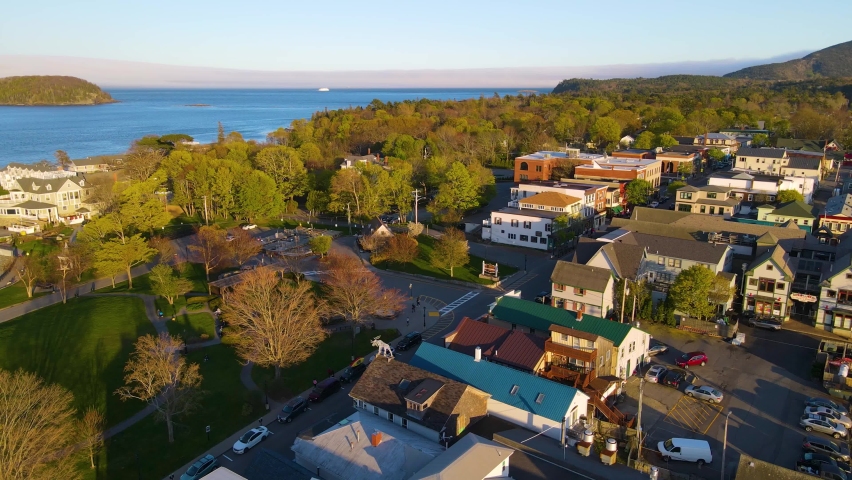 Bar Harbor historic town center aerial view at sunset, with Cadillac Mountain in Acadia National Park at the background, Bar Harbor, Maine ME, USA. 