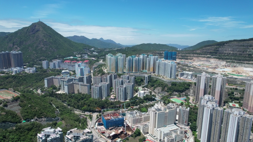 Commercial and residential construction development project in Kwun Tong of Hong Kong city, becoming the newest business district near Kowloon Bay and Victoria harbor, Aerial drone skyview | Shutterstock HD Video #1091108909