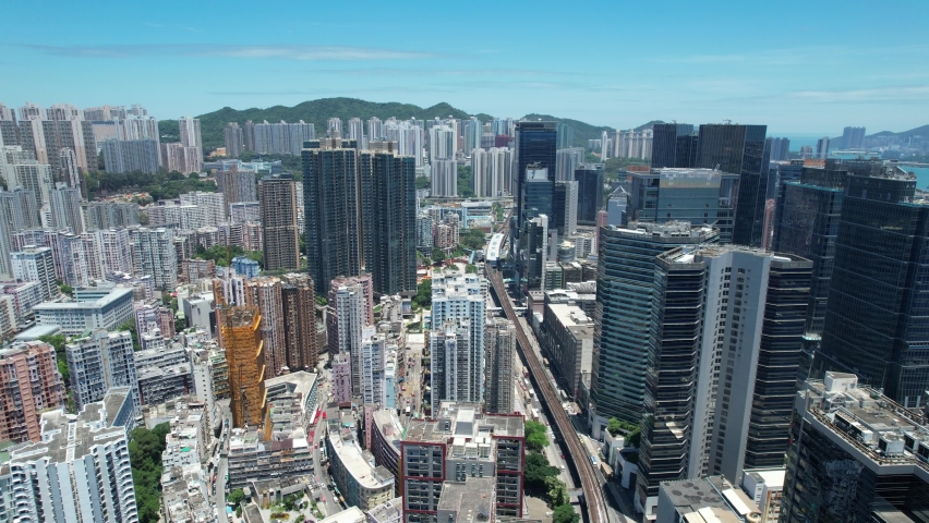 Commercial and residential construction development project in Kwun Tong of Hong Kong city, becoming the newest business district near Kowloon Bay and Victoria harbor, Aerial drone skyview | Shutterstock HD Video #1091108949