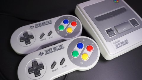 Rome, Italy - June 09, 2022, Super Nintendo Entertainment System (SNES), abbreviated to Super NES or Super Nintendo, a 16-bit video game console, marketed in 1990 in Japan and South Korea.