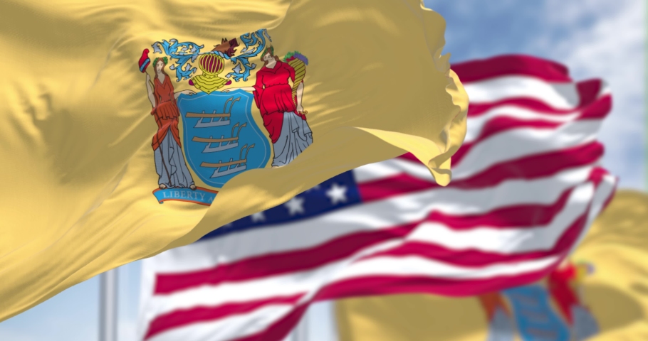 The New Jersey state flag waving along with the national flag of the United States of America. Seamless loop in slow motion. New Jersey s a state in the Northeastern regions of the US
