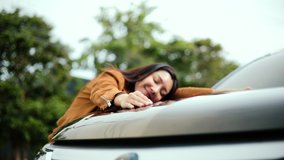 Surprised young asian woman getting the new car. She hugged his car and was very happy. Buy or rent car concept. - Powered by Shutterstock - Get 15% off with code: PIKWIZARD15
