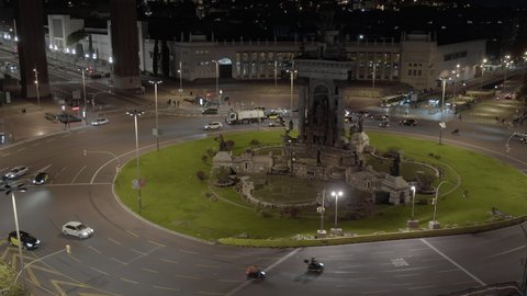 Roundabout in Plaza Espana in Barcelona. Large city square with a fountain sculptural composition in the center and Venetian towers, at night