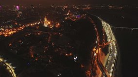 Aerial view of the Kiev-Pechersk Lavra at night with illumination. Panorama of the city of Kyiv, Ukraine