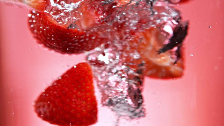 Super Slow Motion Shot of Fresh Strawberries Falling into Water Vortex at 1000 fps. | Shutterstock HD Video #1091133857