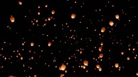 View of sky lanterns floating up through the sky at night during celebration event. - Powered by Shutterstock - Get 15% off with code: PIKWIZARD15