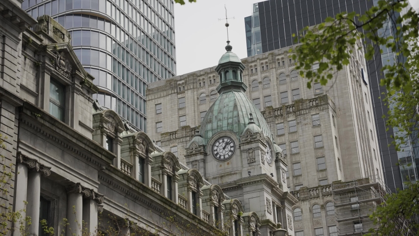 Close up of Sinclair Centre shopping mall detailed copper cupola with clock in Downtown Vancouver, British Columbia, Canada