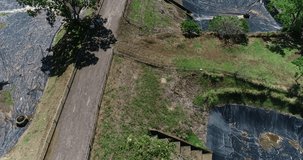 aerial video of sewage treatment plant, residential retention ponds around green area in residential condominium, costa rica
