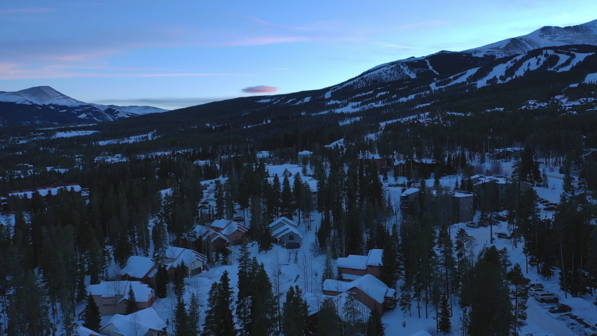 Aerial shot of Georgetown cover with snow and pine tree near the mountain. Georgetown, Colorado. Between mountains.