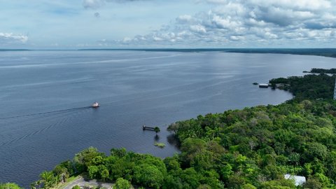 Manaus Brazil. Taruma River at Amazon Forest affluent of giant famous Black River of the Amazonian Biome. Natural wildlife landscape. Global warming logging deforestation. Amazon river rainforest.