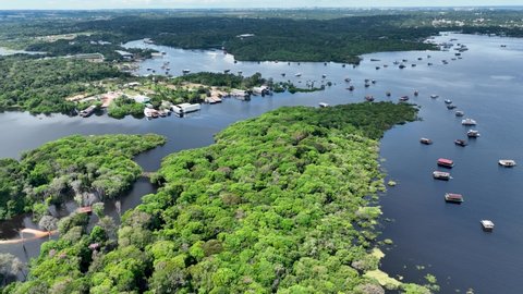 Manaus Brazil. Taruma River at Amazon Forest affluent of giant famous Black River of the Amazonian Biome. Natural wildlife landscape. Global warming logging deforestation. Amazon river rainforest.