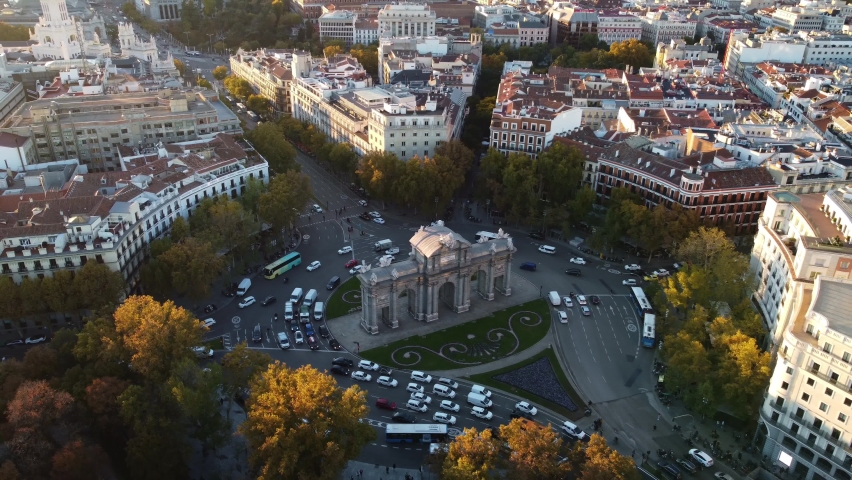 Drone footage of the Puerta de Alcala with a panorama of Madrid in the background. Filming of the famous monument and beautiful streets of the center of Madrid. Royalty-Free Stock Footage #1091154939