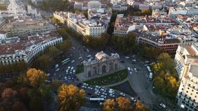 Drone footage of the Puerta de Alcala with a panorama of Madrid in the background. Filming of the famous monument and beautiful streets of the center of Madrid.