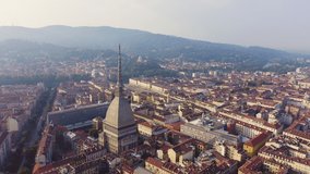 Inscription on video. Turin, Italy. Flight over the city. Historical center, top view. Arises from blue water, Aerial View