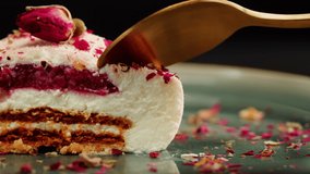 Mousse pink cake, creamy dessert close-up. Honey biscuits, raspberry-cowberry confit, almond streusel, yogurt white chocolate mousse made with honey and lime zest.  - Powered by Shutterstock - Get 15% off with code: PIKWIZARD15