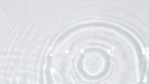 Close up view on Water texture with water circles and drops on the water overlay effect. Organic light gray drop shadow caustic effect with wave refraction of light. Slow motion full HD video banner.