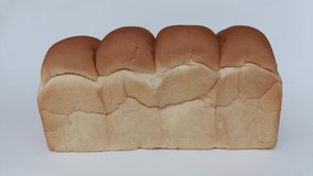 A large loaf of bread, close-up, animated video.