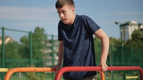 a teenage boy trains on a sports ground outdoors, he does physical exercises, a healthy lifestyle, a bright sunny day in summer
 - Powered by Shutterstock - Get 15% off with code: PIKWIZARD15