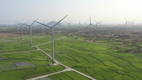 Landscape with Turbine Green Energy Electricity, Windmill for electric power production, Wind turbines generating electricity on rice field at Phan Rang, Ninh Thuan, Vietnam. Clean energy concept.