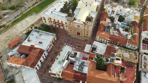 Cartagena, Colombia: Aerial drone footage of the famous Cartagena de Indias colonial old town with the San Pedro Claver catholic church in Colombia, South America. Shot with a downward motion