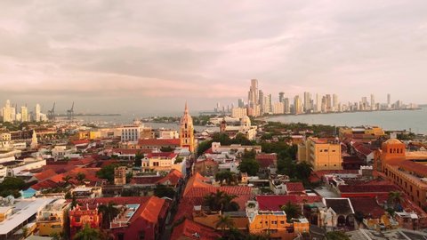 Cartagena, Colombia: Aerial drone footage of the famous Cartagena de Indias colonial old town with the cathedral and the Bocagrande towers in the back by the caribbean sea in Colombia, South America