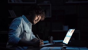 Young indian business man having remote video call conference team meeting working online by distant videocall web chat late at night at home in dark office using laptop computer. - Powered by Shutterstock - Get 15% off with code: PIKWIZARD15
