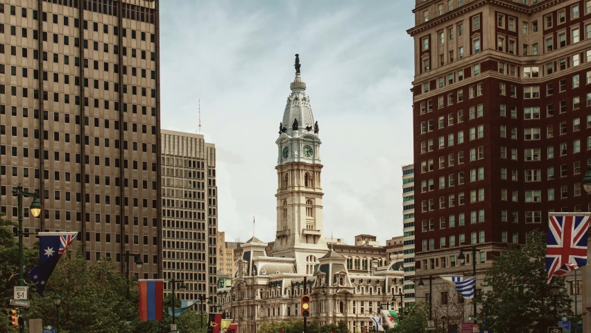 Downtown street view timelapse with City Hall bell tower and urban buildings cityscape in Philadelphia in Pennsylvania USA