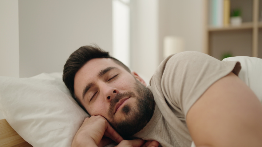 Young hispanic man sleeping on bed at bedroom Royalty-Free Stock Footage #1091200849