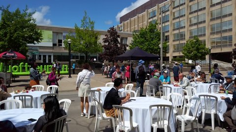TORONTO, CANADA - MAY 28, 2022: Street cafe at the area of University of Toronto near by the Faculty of Arts and Science.