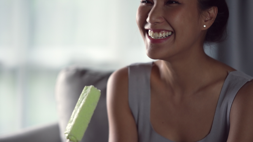 Young Asian woman have sensitive teeth with ice. Woman eating ice cream have toothache. Healthcare concept. Royalty-Free Stock Footage #1091204339