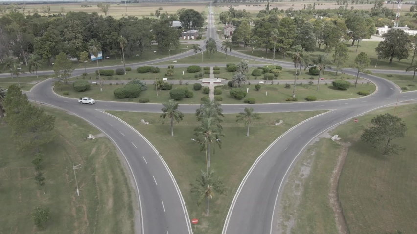 Aerial view with a drone of the elliptical traffic circle in the town of Nuevo Torino, Santa Fe, Argentina. The shape makes it different from the rest. The bushes and plants enrich the shot.