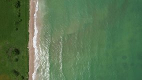 Flying over the beach of São Miguel dos Milagres, touristic and paradisiacal beach in the state of alagoas in brazil. 4k drone video.