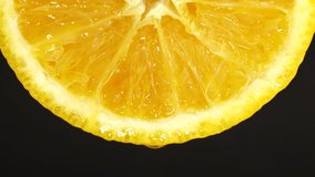 4K Macro shot of navel orange fruit and rotate.Close up fresh citrus orange black background 4K UHD video