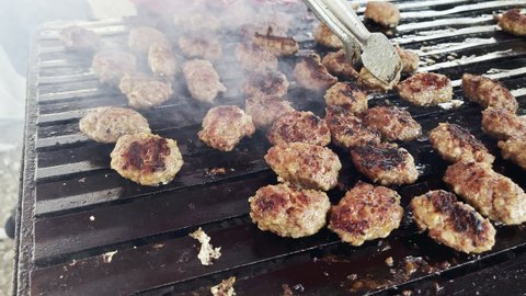 Delicious Meatball Cooking on a Barbecue