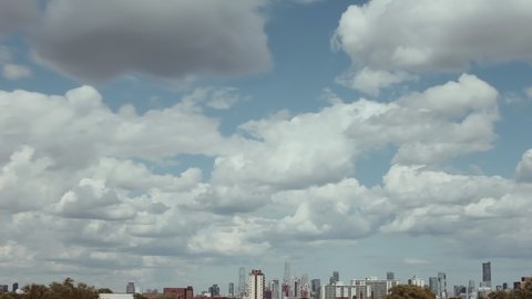 Extreme ultra wide view of the Toronto skyline on a day with puffy clouds. Shot in 4K RAW on a cinema camera.