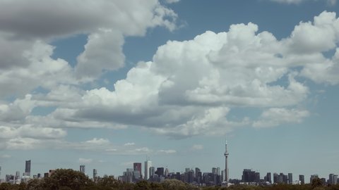 Extreme ultra wide view of the Toronto skyline on a day with puffy clouds. Shot in 4K RAW on a cinema camera.
