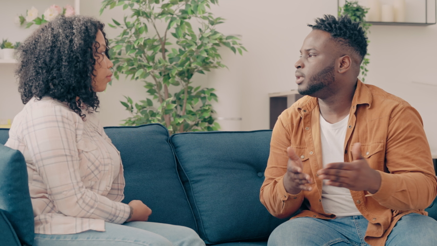 Nervous black man arguing with wife at home, relationship problem, divorce | Shutterstock HD Video #1091260873