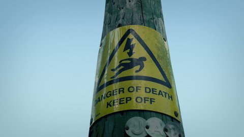 Danger Warning Sign On Electricity Pylon