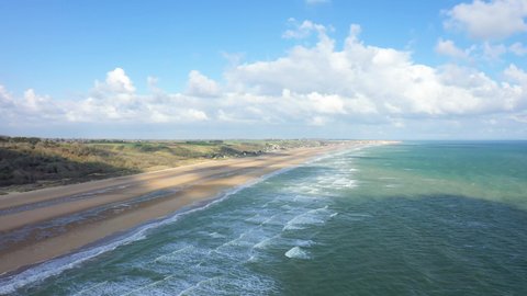 The long sandy beach of Omaha beach in Europe, France, Normandy, towards Carentan, in spring, on a sunny day.