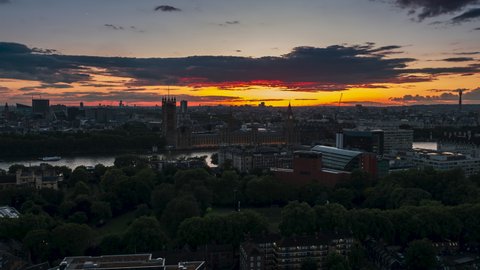 Exeptional Sunset in capital, Establishing Aerial View Shot of London UK, United Kingdom, Palace of Westminster, Parliament, close view, rise up crane shot