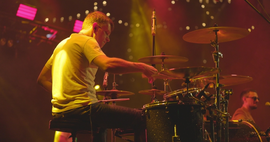 Back view of drummer playing drums at the stage on live concert Royalty-Free Stock Footage #1091268087
