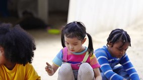 Group of Diversity children kid playing sand with toy together at playground in the park on summer vacation. Little child boy and girl friends enjoy and fun outdoor activity playing together at school - Powered by Shutterstock - Get 15% off with code: PIKWIZARD15