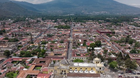 Slow aerial hyperlapse push in on the Santa Catalina Arch in Antigua, Guatemala.
