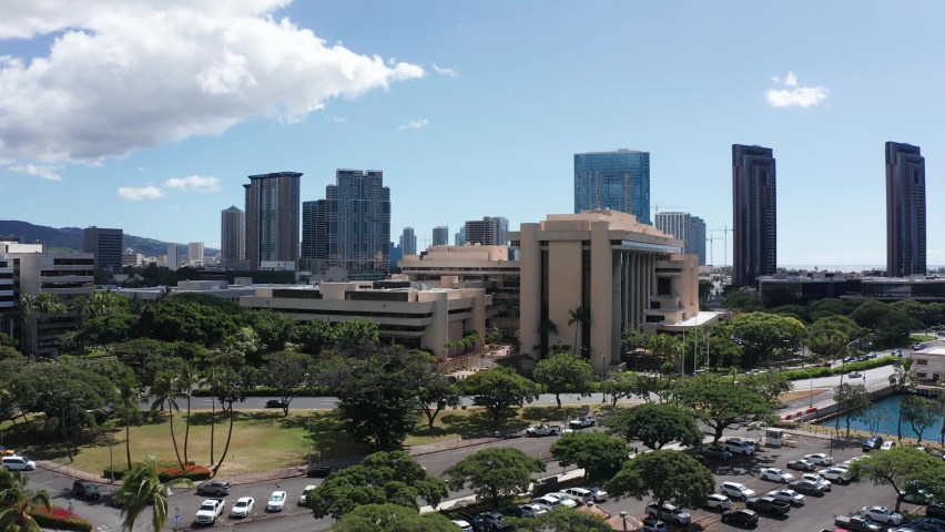 Rising push-in aerial shot of downtown Honolulu, Hawaii. 4K