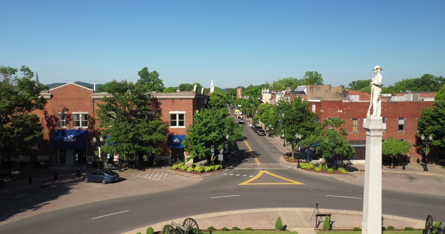 Franklin, Tennessee downtown with fly by statue with drone video moving forward.