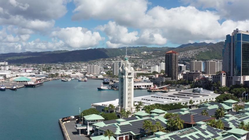 Aerial push-in close-up shot of the Aloha Tower in the Port of Honolulu on the island of O