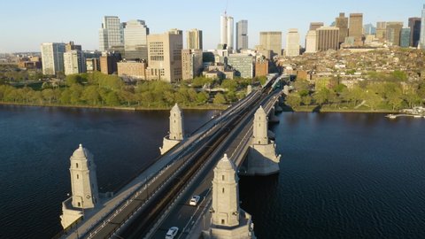 Boston T Train Crossing Bridge to Downtown City on Beautiful Day