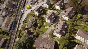 Lausanne city viewed by drone, aerial clip. Switzerland. Houses, crane, roads