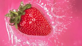 Super slow motion of falling Strawberry into splashing water. Filmed on high speed cinema camera - Powered by Shutterstock - Get 15% off with code: PIKWIZARD15